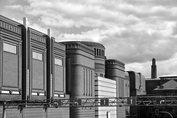 Metal structure for road signs and brick buildings of a historic brewery in the city of Poznan