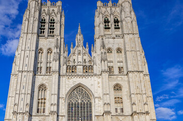 The Cathedral of St. Michael and St. Gudula facade with stained glass windows and bell towers, medieval Roman Catholic cathedral Brabantine Gothic style building in Brussels city center, Belgium