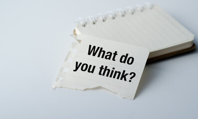 A piece of paper with the words "What do you think?" written on it