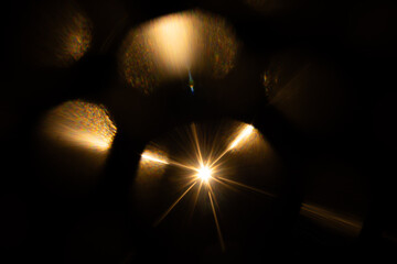 Lens Flare. Light over black background. Easy to add overlay or screen filter over photos. Abstract...