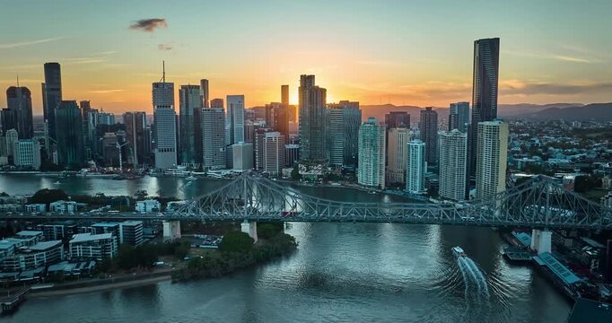 4K aerial locked down stationary day to night Time Lapse motion view of the Story Bridge and east side of Brisbane CBD and the Brisbane River, Brisbane, Queensland, Australia