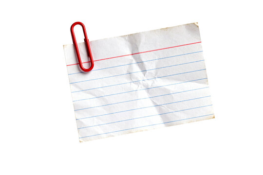 Wrinkled blank index card note with a red paperclip for messages, isolated on transparent background.