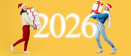 Two friends are joyfully holding gifts while wearing festive clothing and Santa hats. The background features a bright yellow color and the year 2026. Their expressions show excitement and happiness.