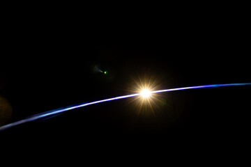 Lens Flare. Light over black background. Easy to add overlay or screen filter over photos. Abstract...