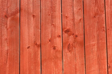 Fototapeta premium Red wooden planks. Vertical lines.Outside photo.