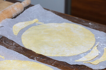 Female Baker Making Round Cake Layers from Dough
