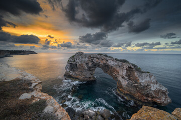 Dramatic sunset at Es Pontàs rock arch, Mallorca
