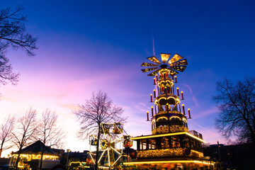 Colorful Christmas Festival Float With Illuminated Decorations, Stars, And Windmill Top
