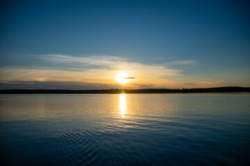Sun reflecting off the lake nearing sunset Ontario Canada