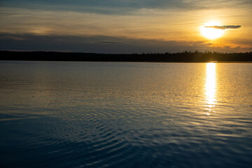 Sun reflecting off the lake nearing sunset Ontario Canada