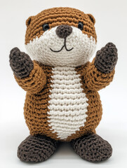 A cute handmade otter plushie, with a cozy texture, stands in a playful pose
