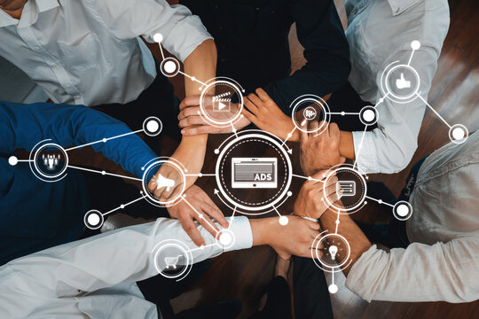 A dynamic representation of teamwork in digital advertising, showcasing hands coming together to symbolize collaboration, unity, and innovative marketing strategies through technology. Amity