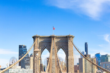 Fototapeta premium The pedestrian section of the Brooklyn Bridge in New York City is empty of people during the day.