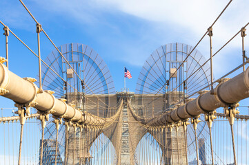 The pedestrian section of the Brooklyn Bridge in New York City is empty of people during the day.