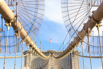 The pedestrian section of the Brooklyn Bridge in New York City is empty of people during the day.