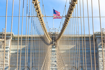The pedestrian section of the Brooklyn Bridge in New York City is empty of people during the day.