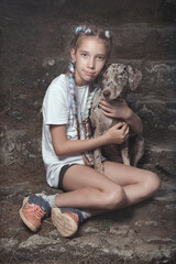 Nice young lady posing on stairs with her lovely leopard dog