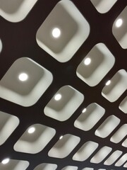 Lamps Installation Embedded in Rounded Square Frames Rounded Lights, Geometric Installation, Diagonal Perspective with 3d effect and spatial depth, contemporary lighting interior design