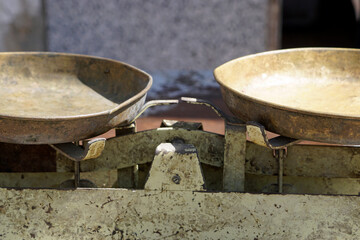 Close up of old, rusty, two pan balance scale