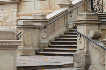 old school urban cathedral architectural patterns of ancient marble stairs and handrails historical building entrance shapes close up