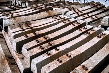 Stacked Rough Concrete Railway Sleeper with Rusty Fasteners Architecture Element