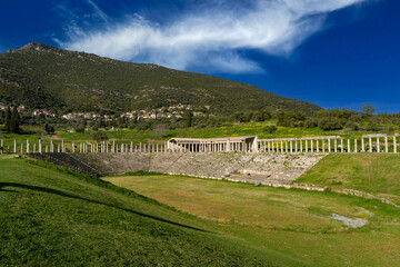 Naklejka premium Greece, Peloponnese, Ancient Messene - 3 April 2024 - The ancient stadium and the landscape of the ancient city of Messene