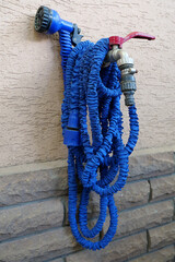 Outdoor tap for watering a garden plot. Water tap outside the building