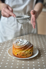 Hand Dusting Easter Cakes with Powder
