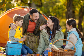 Family enjoys picnic in a sunny park