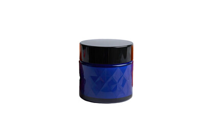 Small jar with black lid, blue diamond patterned body sits against a stark black backdrop