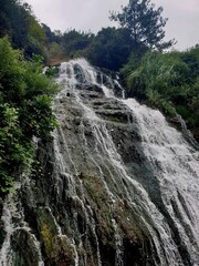 waterfall in the mountains and trees