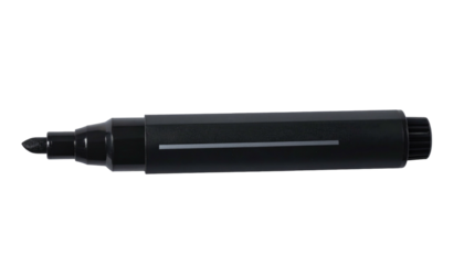 A black marker with a chisel tip lays horizontally against a plain black background