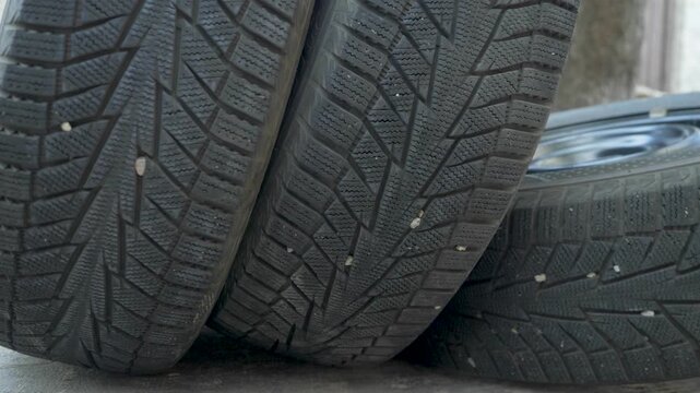 Car tires with deep tread. Rubber with deep tread ensures control in icy condition. Summer models must be replaced. Time for winter tire change. Road safety requires proper equipment
