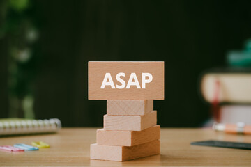There is wood block with the word ASAP. It is an abbreviation for As soon as possible as...