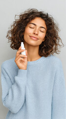 Woman holding nasal spray for world allergy awareness day vertical portrait