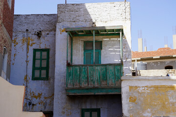 Dilapidated old wooden balcony in El Quseir