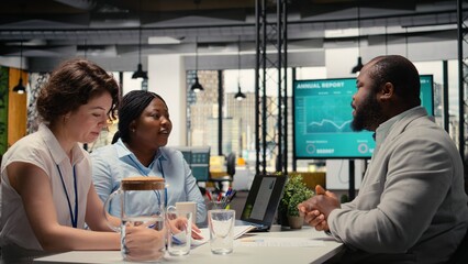 HR department workers hosting career meeting to discuss new job opening and career opportunity, recruitment process for talent acquisition. Man presenting experience during interview. Camera A.