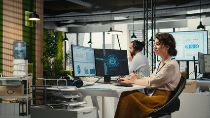 Office administrator checking monthly reports with AI analytics platform, employing neural networks...