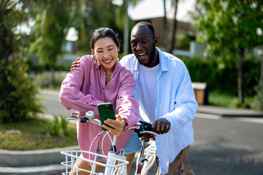 Diverse couple enjoying vacation, embracing travel, relaxation, and happiness in tropical paradise