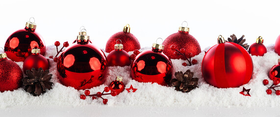 Christmas balls in a row on the snow