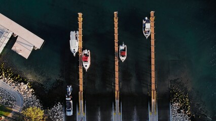 Boats lined up at a marina ramp ready for a day on the water during sunny weather