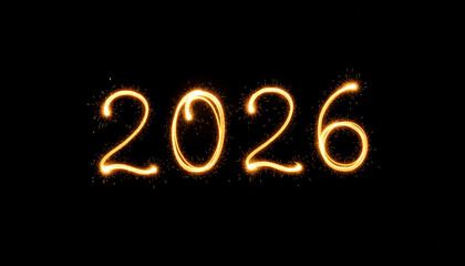 The year 2026 written in glowing sparklers against a dark background