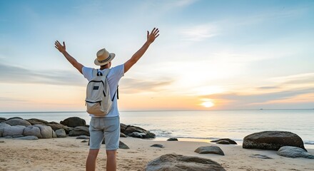 Traveler enjoying beach sunset vacation with backpack hat