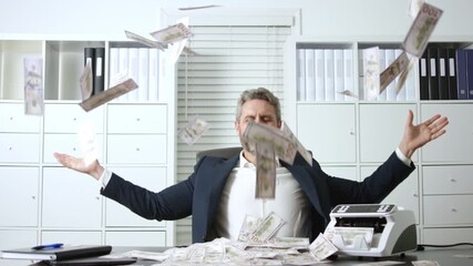 Happy businessman celebrating success. Money flying around in office. Joyful moment of financial freedom. Wealth and abundance concept. Successful man enjoying achievement.