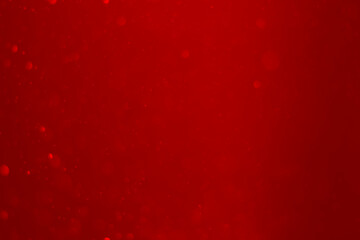 blurred red glitter vintage lights background.  red bokeh shiny on dark background.