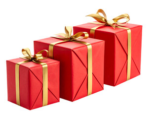Fototapeta premium Three red gift boxes with gold ribbons stand in a diagonal line against a black backdrop