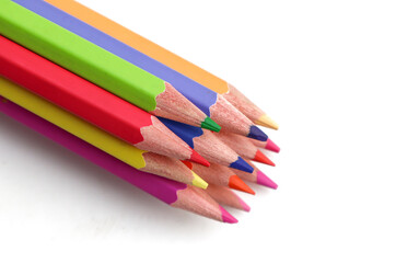 Many colorful pencils on white background
