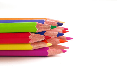 Many colorful pencils on white background