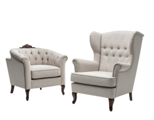Two cream-colored armchairs with button-tufted backs & dark wood legs are isolated on a black background