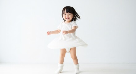 Happy child twirls playfully in white dress bright studio light creates a clean minimalist aesthetic. AI Generated